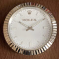 An ROLEX INSPIRED WALL CLOCK - OYSTER - RL-66 with the word ROLEX on it.