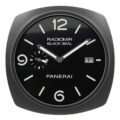 Panerai wall clock with a rounded square black frame, black dial, pale-colored numerals, 