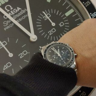 A photo of a customer opening a package containing a Rolex wall clock