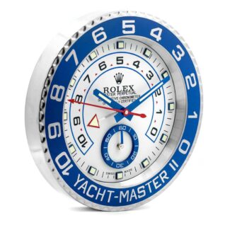 Rolex Yacht-Master II wall clock featuring a white dial, blue bezel, regatta timer markings, red and blue hands, and seconds subdial.