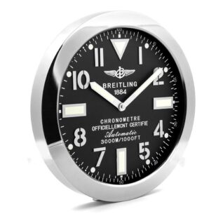 Breitling wall clock with a black dial, stainless steel case, clear markers, bold numerals, sword-shaped hands, and a rugged aviation design.