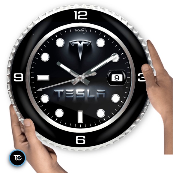 A Tesla wall clock featuring the iconic Tesla logo.
