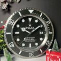 Rolex Submariner wall clock with a black dial and a rotating bezel.