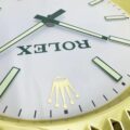 A close up of a ROLEX WALL CLOCK - GOLD OYSTER DATEJUST - GOLD - RL212 with the word