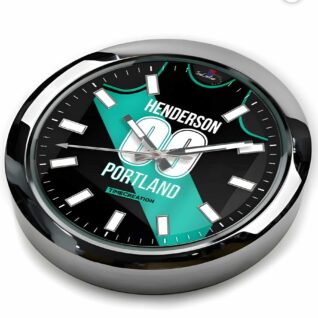 A PORTLAND TRAIL BLAZERS Henderson Basketball wall Clock with a green and white logo featuring the PORTLAND TRAIL BLAZERS.
