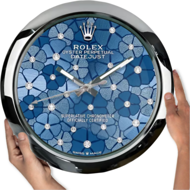 A person holding a large wall clock designed to resemble a Oyster Perpetual 'Azzurro' Edition watch.