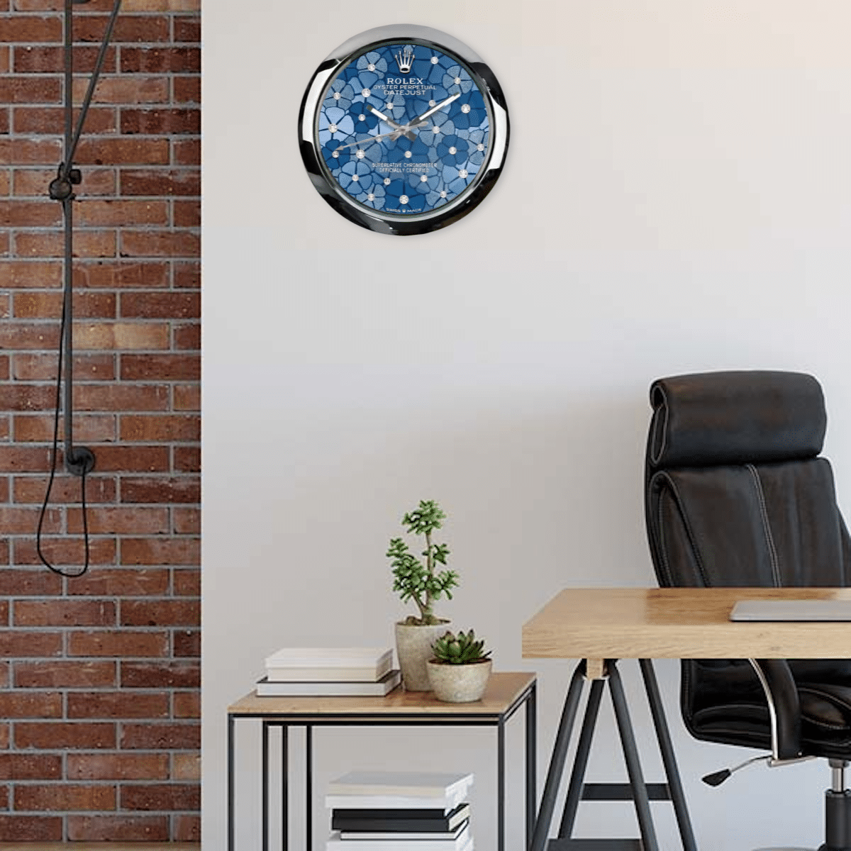 Modern home office with an Oyster Perpetual 'Azzurro' Edition wall clock, exposed brick wall, wooden desk, black office chair, and a small plant on a side table.