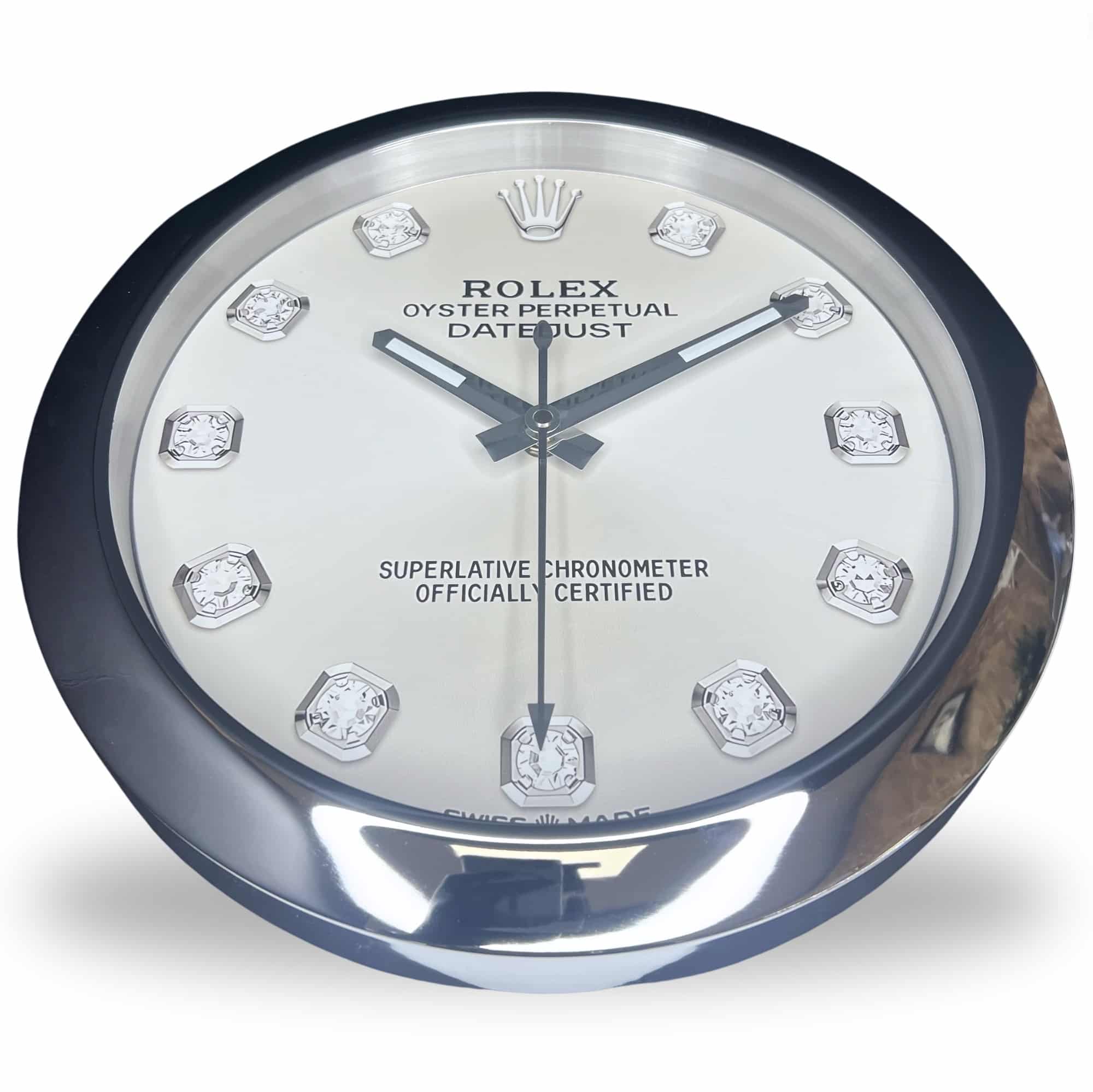 Close-up of a Rolex Oyster Perpetual Datejust clock face with diamond hour markers and silver hands showing the time as 10:10:30 on a white background.