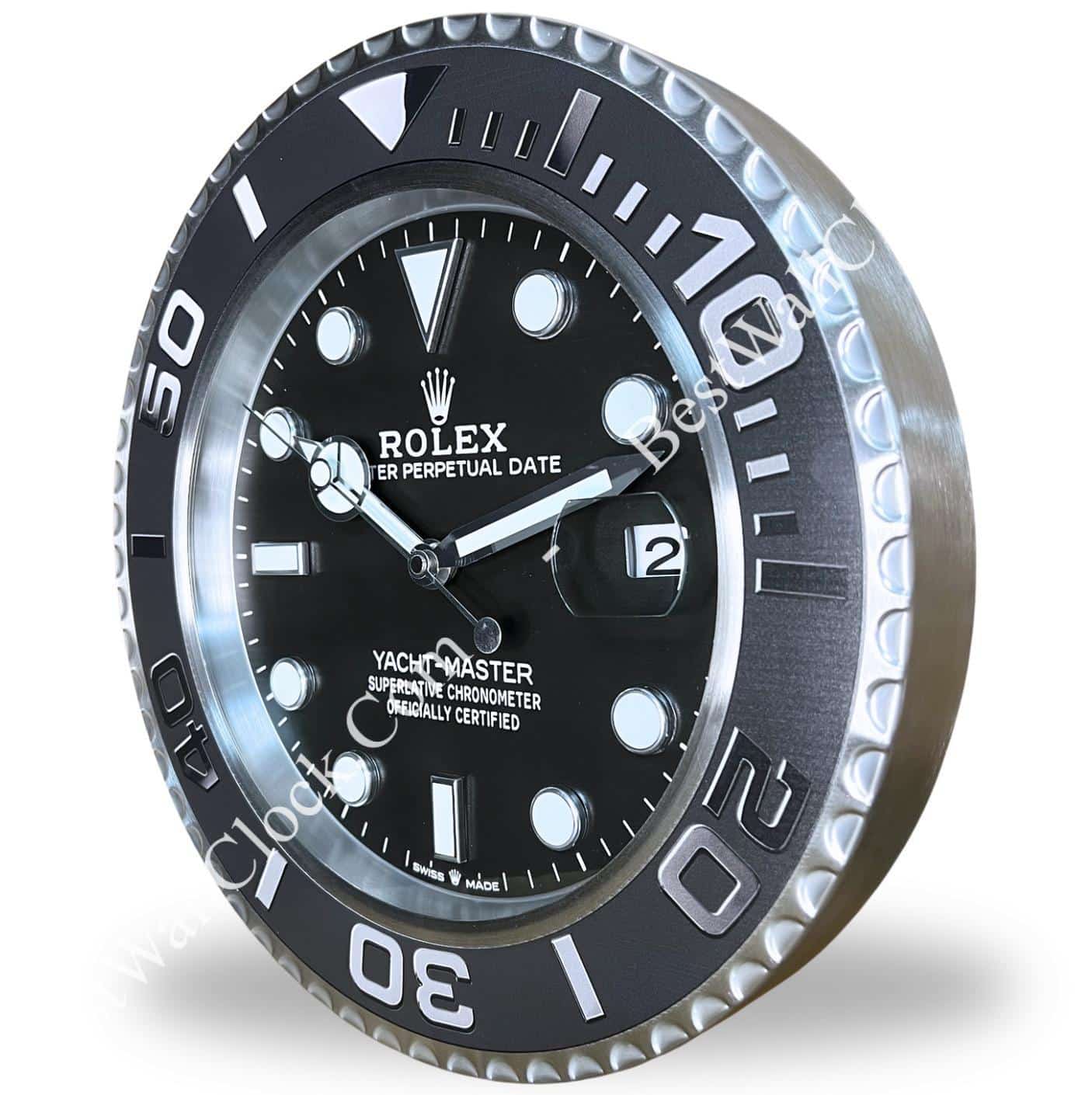 Rolex wall clock designed to resemble a Rolex Yacht-Master watch face with black dial and silver markings.
