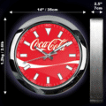 Round Coca-Cola wall clock with a red face, white markers, and silver frame, showing dimensions 14 inches (35 cm) diameter, 2.5 inches (7 cm) depth, and weight 1.2 kg (2.6 lb) on a black background.