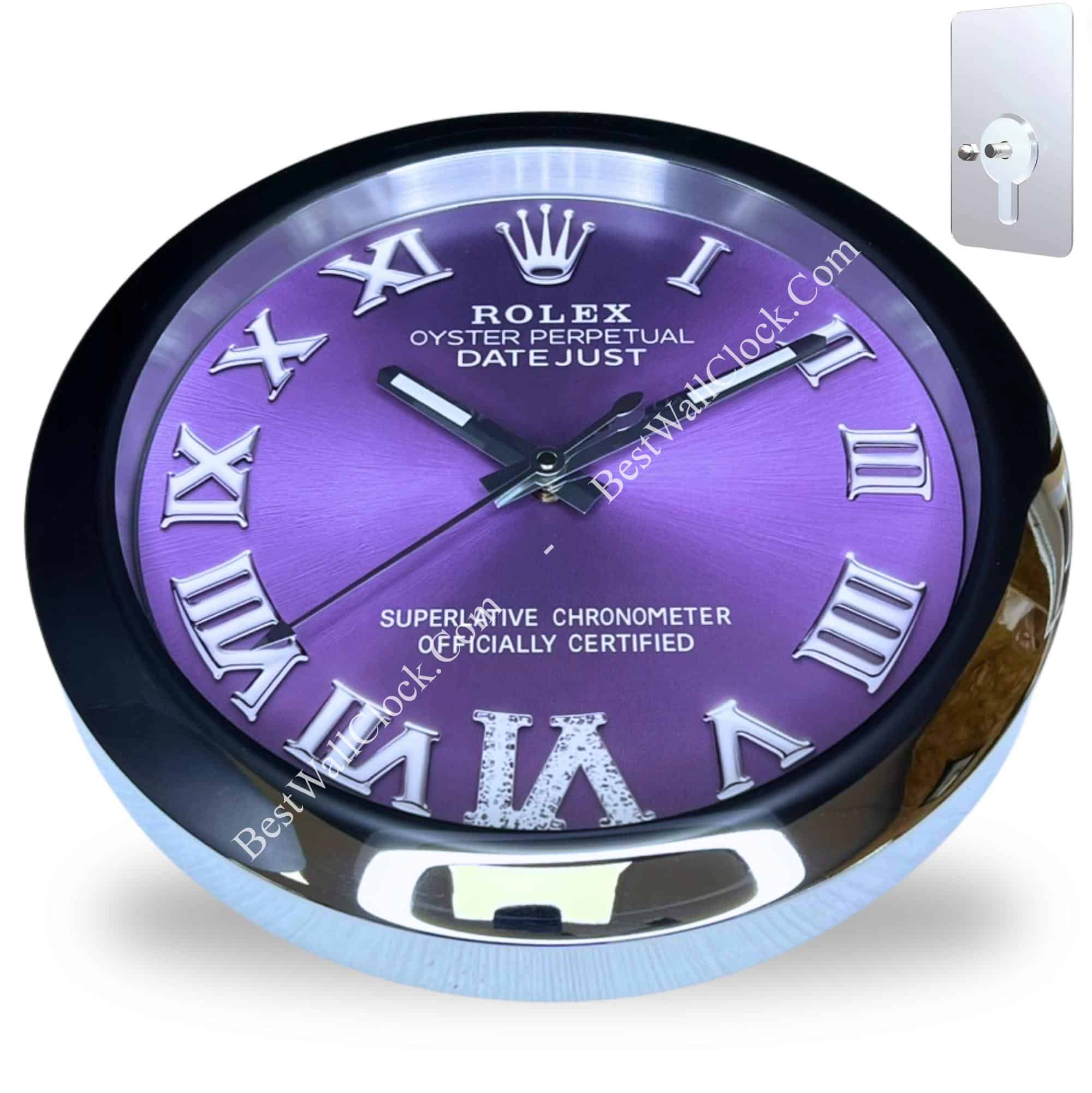 Round wall clock with a purple face and silver Roman numerals, black hands, and a metallic rim, styled like a Rolex Oyster Perpetual Datejust watch, showing time at 10:10.