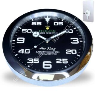 Round wall clock designed like a Rolex Air-King watch face with black dial, white numerals and markings, and silver trim, showing the time as 9:10:40, mounted on a white background with a metal keyhole plate in the upper right corner