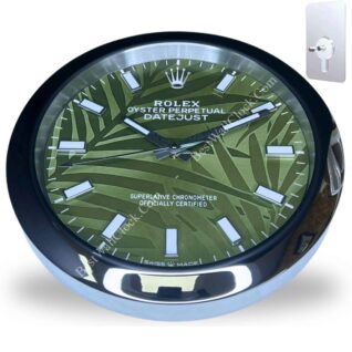 Round wall clock designed to resemble a Rolex Oyster Perpetual Datejust watch face with a green patterned background, white rectangular hour markers, and silver hands, encased in a shiny silver and black frame, displayed with a separate mounting key plate in the top right corner.
