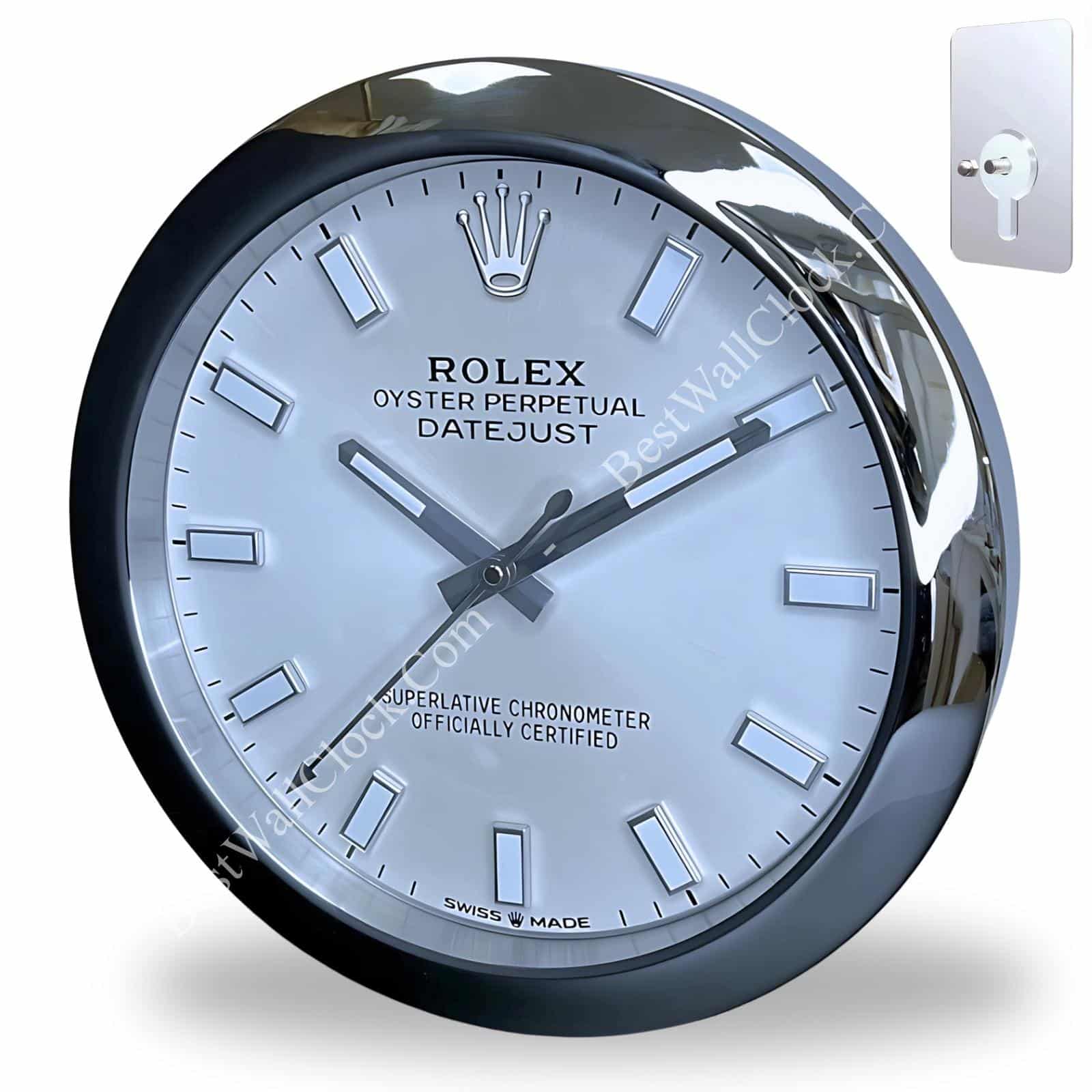 Close-up of a round wall clock designed to resemble a Rolex Oyster Perpetual Datejust watch, featuring a white face, silver rectangular hour markers, and silver hands, with the Rolex crown logo at the top and text labels including 'Rolex Oyster Perpetual Datejust', 'Superlative Chronometer Officially Certified', and 'Swiss Made'