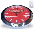 Round wall clock with a red face featuring the Coca-Cola logo and a silver rim, along with a metal wall mount plate shown separately.