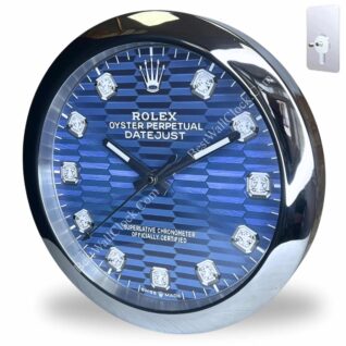 Round wall clock designed to resemble a Rolex Oyster Perpetual Datejust watch with a blue textured dial, diamond hour markers, and silver-tone bezel and hands, showing the time as 10:08.