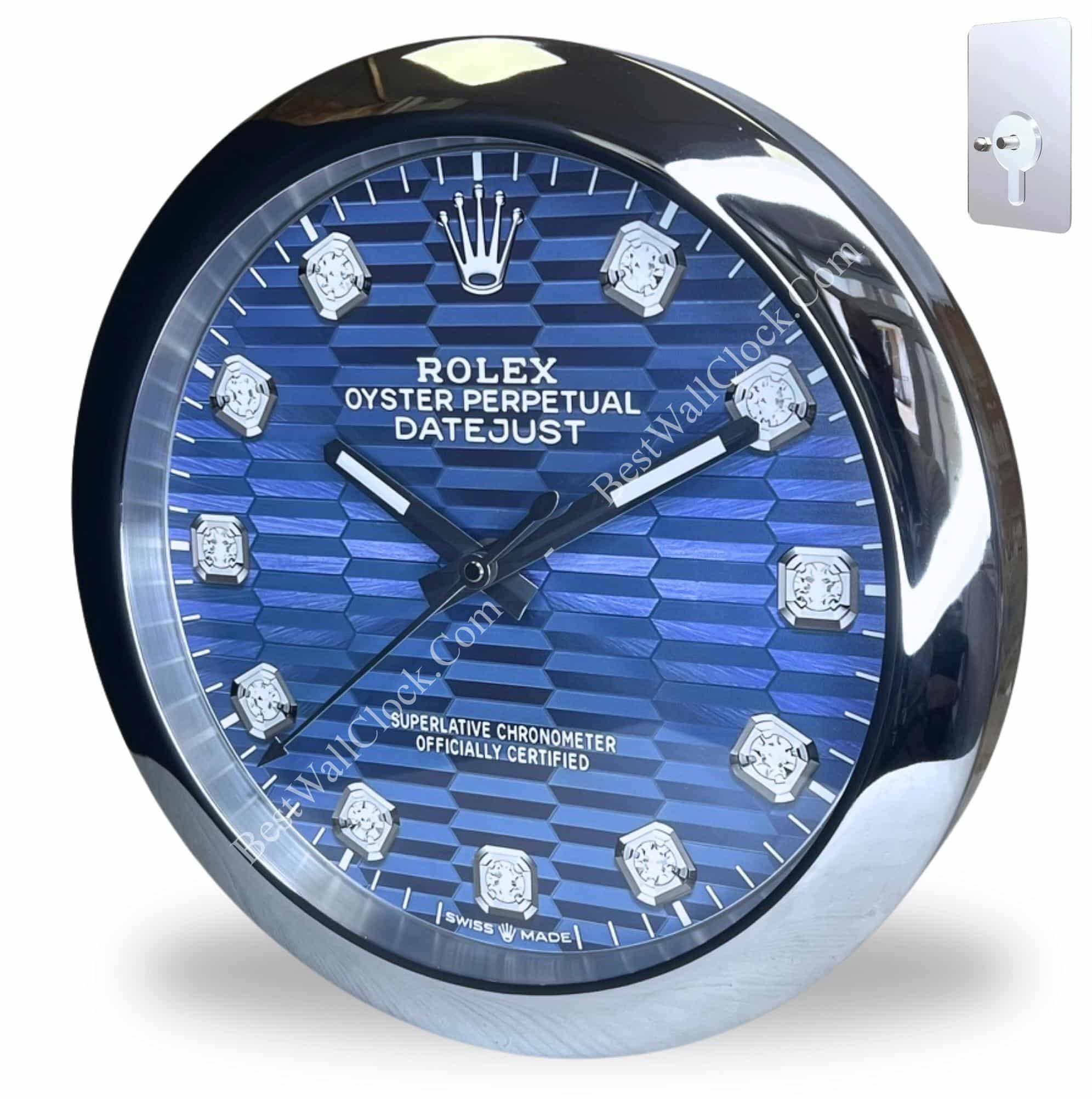 Round wall clock designed to resemble a Rolex Oyster Perpetual Datejust watch with a blue textured dial, diamond hour markers, and silver-tone bezel and hands, showing the time as 10:08.