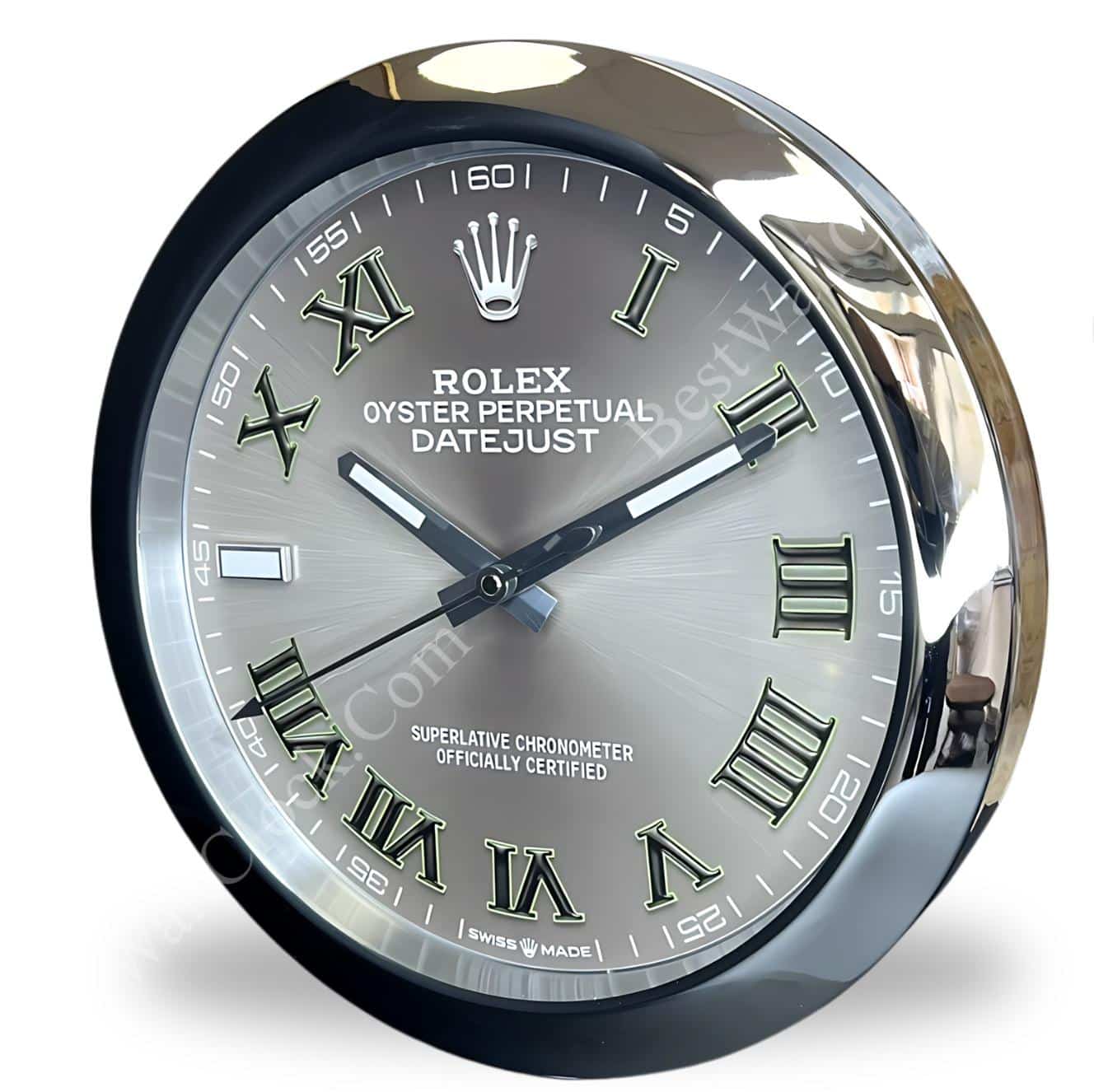 Rolex well clock featuring a round face with silver Roman numerals on a grey dial and a shiny metallic frame