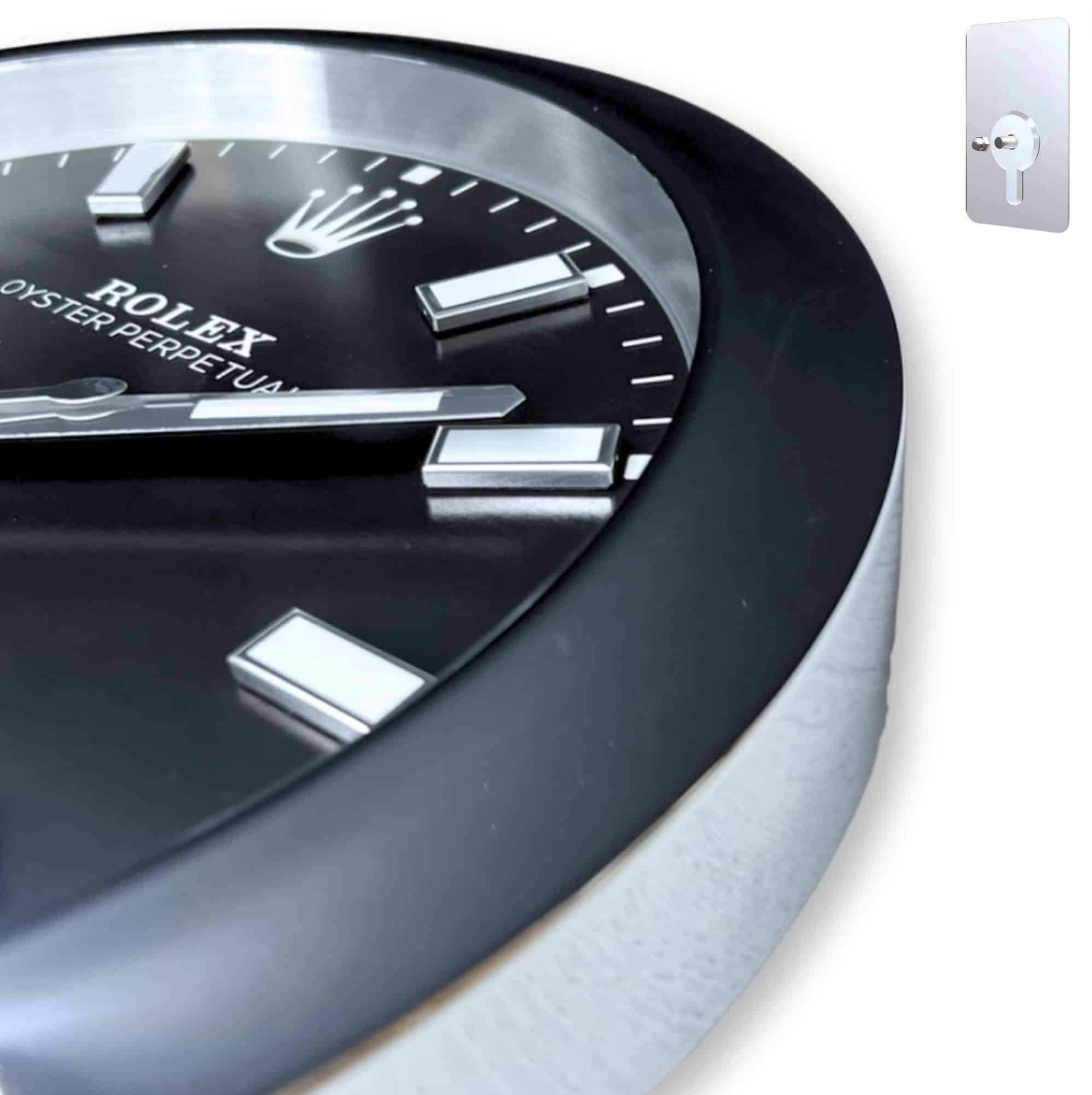 Close-up of a black and silver rolex wall clock showing the ROLEX logo and oyster perpetual text on its face, featuring metallic hour markers and hands.