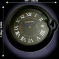 Rolex wall clock styled like a Cartier wristwatch with Roman numerals, measuring 14 inches (35 cm) in diameter and weighing 1.2 kg (2.6 lb) against a dark background.