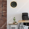 Rolex well clock on the wall above a side table with plants and books beside a desk with a black office chair in a modern room with a brick accent wall