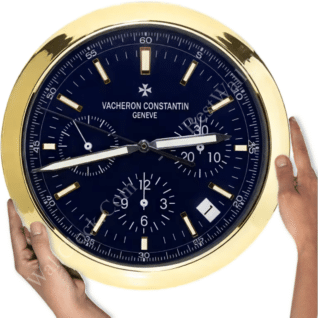 rolex well clock showing a large round Vacheron Constantin watch face with gold trim and hands, held by two hands against a white background