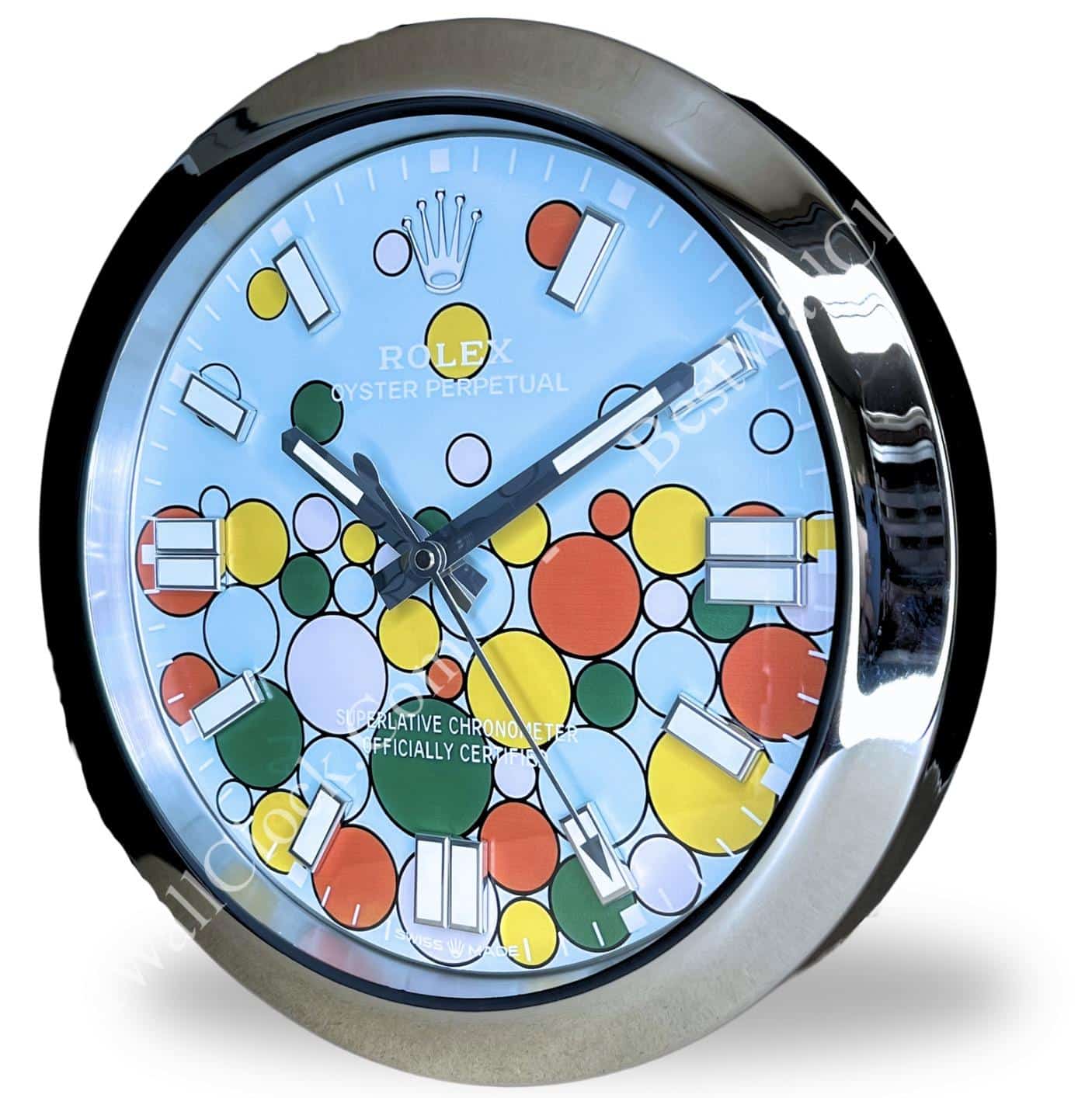 rolex wall clock with a shiny metallic frame and a colourful dial featuring multicoloured circles and bold white hour markers