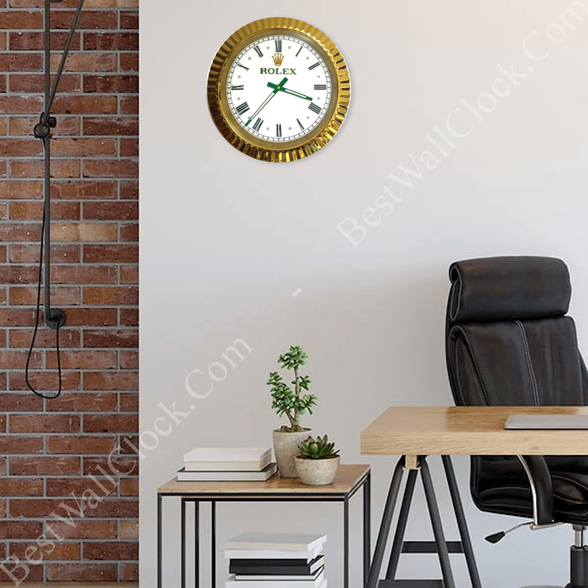 rolex well clock gold-framed wall clock with white face and roman numerals hanging above a wooden desk and black office chair in a modern workspace with brick and white walls