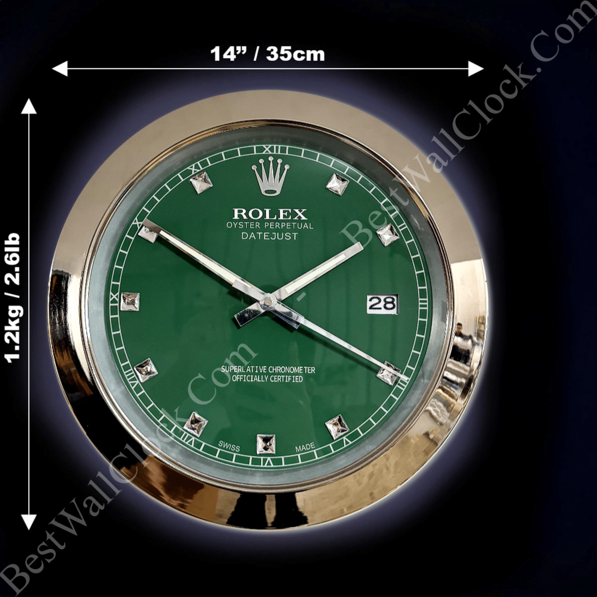 rolex well clock featuring a round wall clock with a green face, silver diamond-shaped hour markers, silver hands, a date display at 3 o'clock, and a polished silver frame, measuring 14 inches in diameter and weighing 1.2 kg