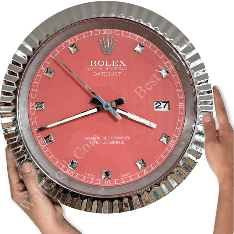 Rolex well clock showing a pink dial with silver hour markers and hands, held by two hands against a white background