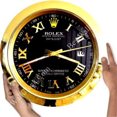Close-up of a gold and black Rolex wall clock with Roman numerals and date display, held by two hands on either side.