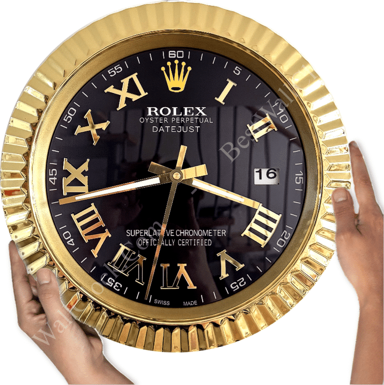 Gold-framed Rolex Oyster Perpetual Datejust wall clock with black face, gold Roman numerals, date display at 3 o'clock, and two hands showing 8:19, held by two hands on a white background.