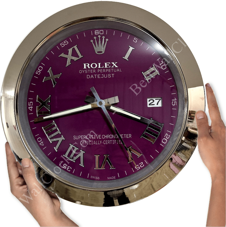 Hands holding a round wall clock with a purple face, featuring Roman numerals, silver hands, a date display showing 27, and the brand name Rolex with the text Oyster Perpetual Datejust and Superlative Chronometer Officially Certified.
