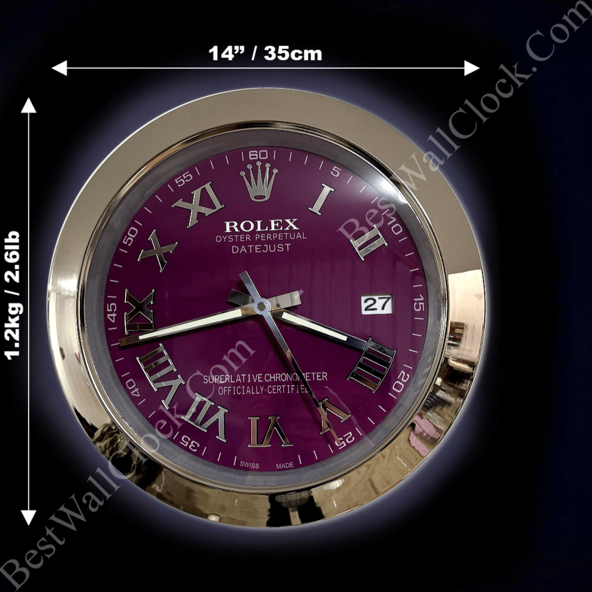 Round wall clock with a gold rim and a purple face, displaying Roman numerals and the brand name Rolex Oyster Perpetual Datejust, with dimensions indicated as 14 inches (35 cm) in diameter and weight 1.2 kg (2.6 lb).
