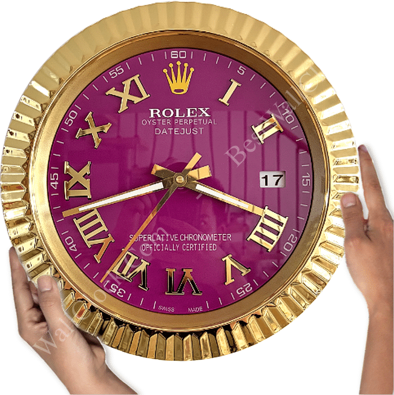 Gold-framed Rolex wall clock with a purple face, Roman numerals in gold, date display showing 17, and two hands held by a pair of hands on either side
