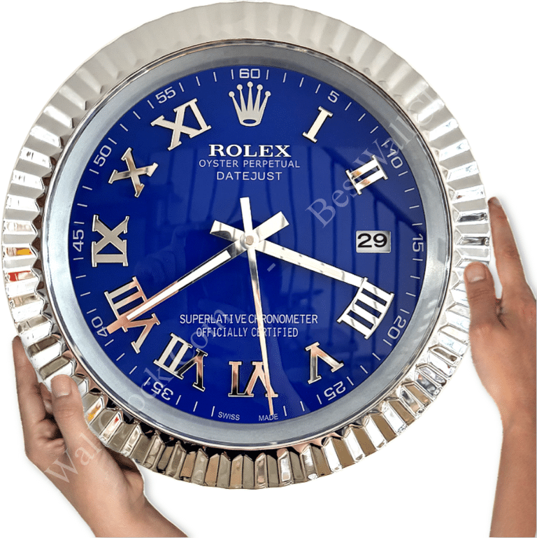 Blue Rolex Oyster Perpetual Datejust wall clock with silver Roman numerals and hands, held by two hands against a white background