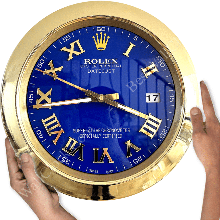 Close-up of a large Rolex Oyster Perpetual Datejust wall clock with a blue dial, gold Roman numerals, and gold hands, showing the date as 17, held by two hands on a white background