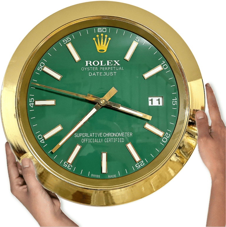 Hands holding a large gold-framed Rolex Oyster Perpetual Datejust wall clock with a green face displaying the time as 3:38:47 and the date as 11.