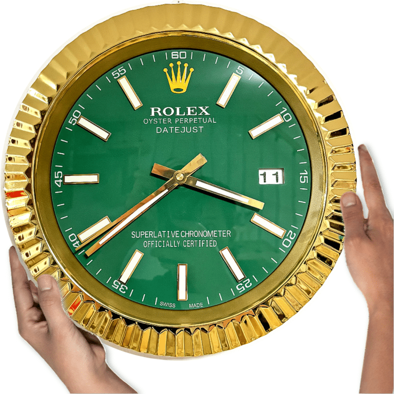 A large round Rolex wall clock with a gold fluted bezel and green face displaying the time 3:38, held by two hands on either side, featuring white hour markers and a date window showing '11'.