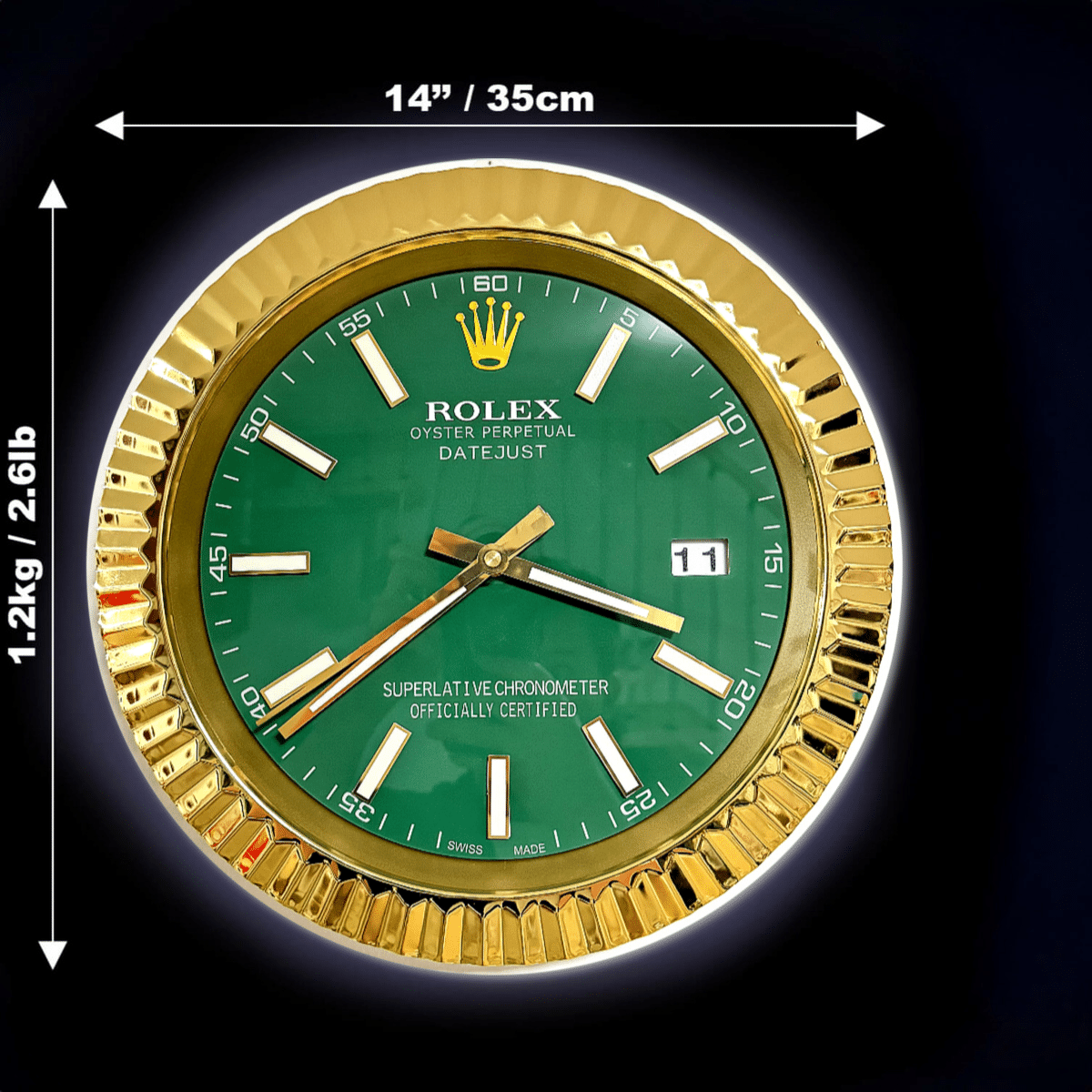 Green and gold wall clock designed like a Rolex Oyster Perpetual Datejust watch with gold hour markers and hands, showing measurements of 14 inches (35 cm) in diameter and weighing 1.2 kg (2.61 lb).
