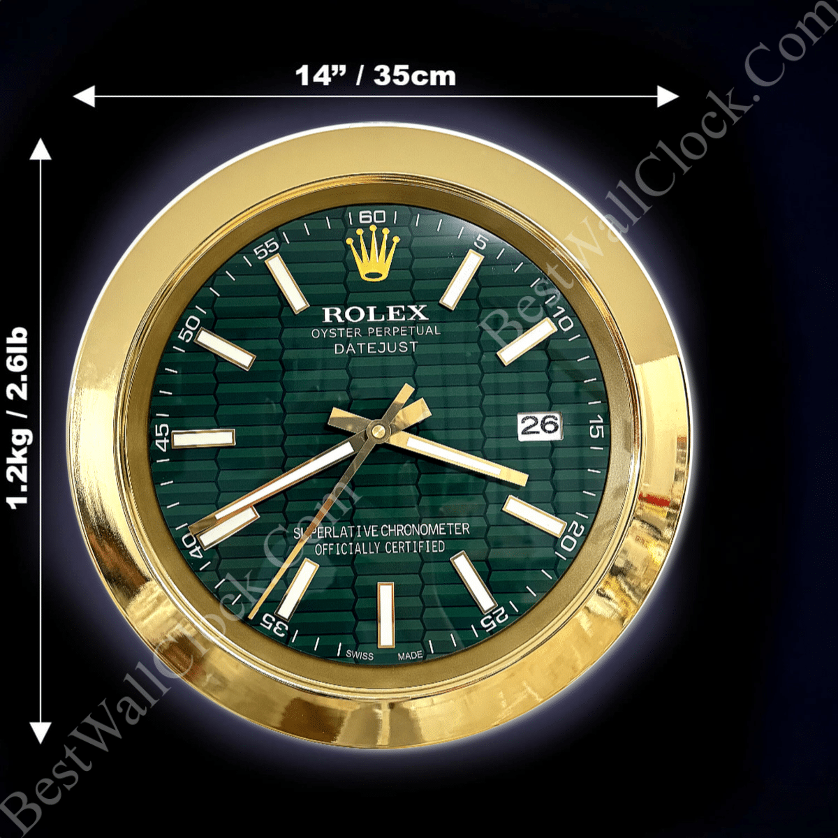 Round Rolex wall clock with a green textured dial, gold hour markers and hands, gold bezel, displaying date 26, measuring 14 inches (35 cm) in diameter and weighing 1.2 kg (2.6 lb) on a dark background