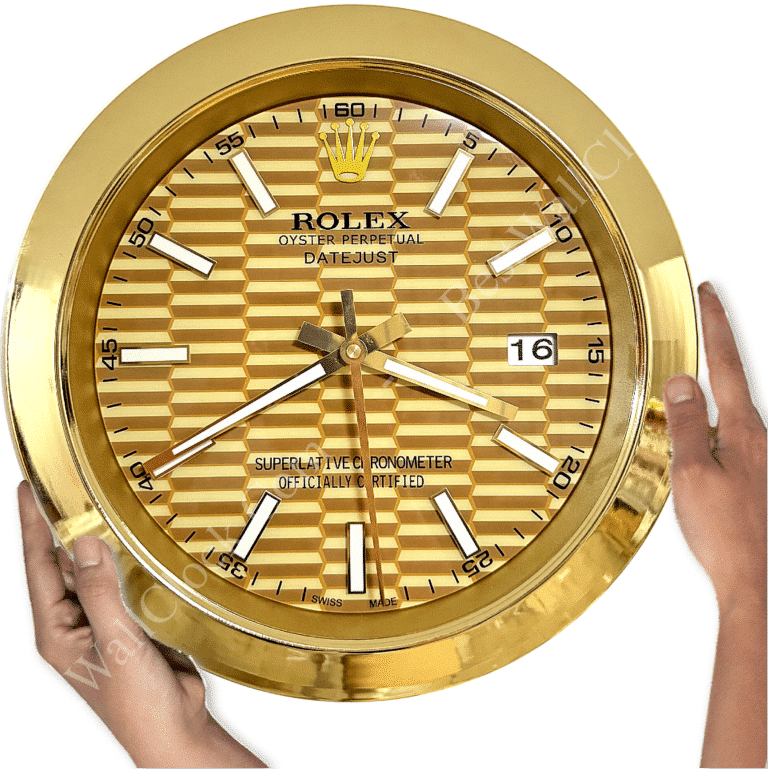 Gold-coloured Rolex wall clock with textured face, white hour markers and hands, a date display showing 16, held by two hands against a white background