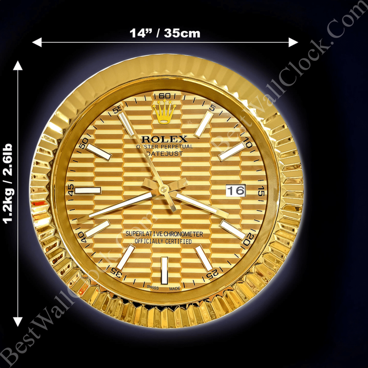 Round gold wall clock resembling a Rolex watch face with textured pattern, white hour markers, and white hands, showing the date as 16, with dimensions 14 inches by 14 inches and weight 1.2 kg noted around it on a black background