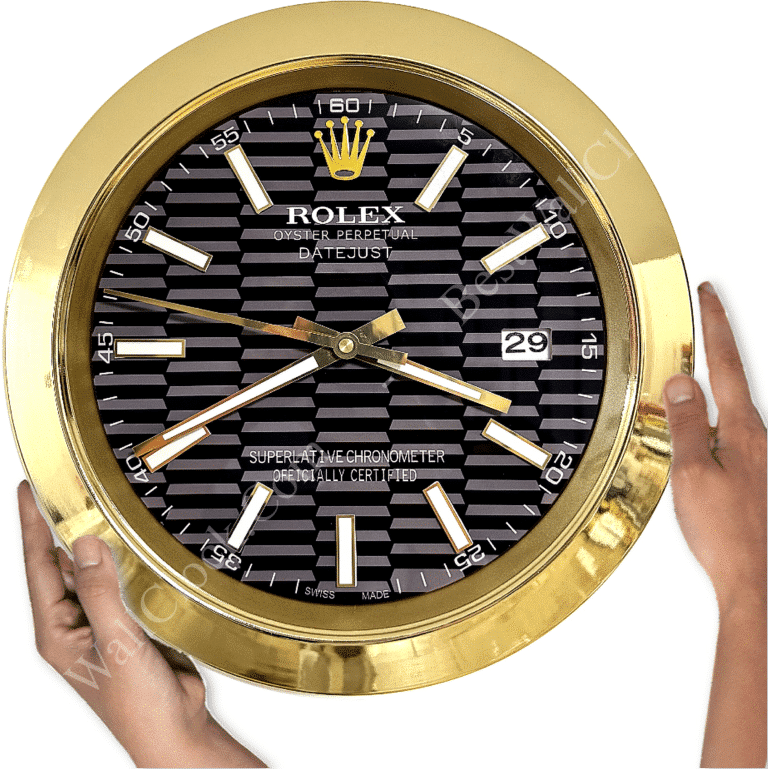 Rolex well clock showing black and grey striped face with gold bezel, gold hour markers, and date display at 3 o'clock, held by two hands.