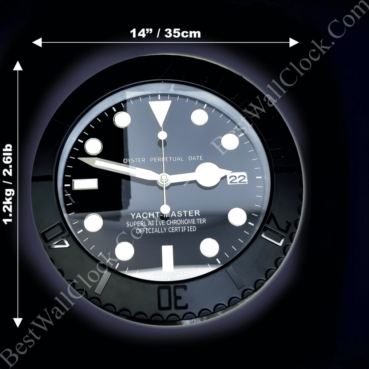 Close-up of a black Yacht-Master watch face with white round and rectangular hour markers, luminous white hands, a date window showing 22, and measurements 14 inches (35 cm) width and 1.2 kg (2.6 lb) weight indicated around the clock.