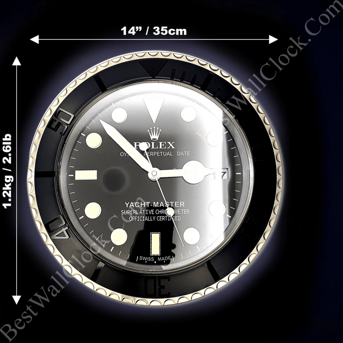 Black and silver Rolex Yacht-Master clock with luminous round markers and hands, showing time at 10:15:33, with 14 inches / 35 cm diameter and 1.2 kg / 2.6 lb weight indicators on a dark background.