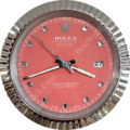 rolex well clock showing a close-up of a silver-framed wall clock with a pink dial, silver diamond-shaped hour markers, and a date display at 3 o'clock