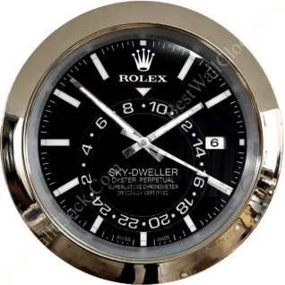 Close-up of a Rolex Sky-Dweller watch face with a black dial, white hour markers, silver hands, and a date window at 3 o'clock, surrounded by a metallic bezel.