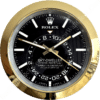Rolex Sky-Dweller clock with black dial, white hour markers, gold frame and hands, showing time at 10:52:19