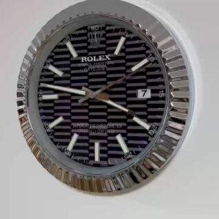 Close-up of a Rolex Oyster Perpetual Datejust watch face with a black patterned dial, silver hour markers, hands, date window showing 7, and a fluted silver bezel.